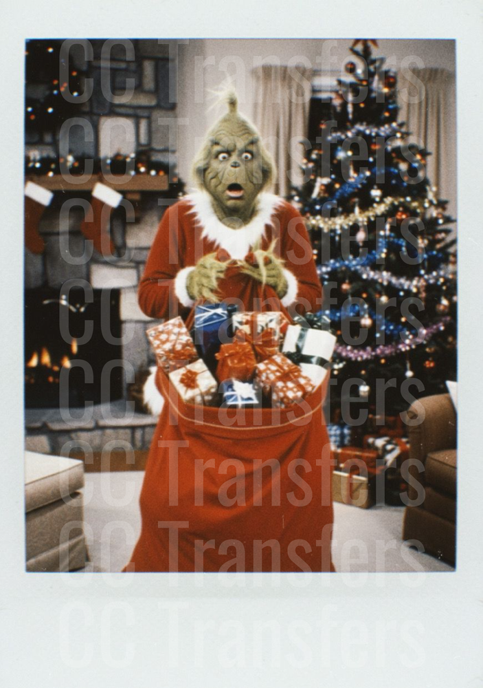 Grumpy Green Creature Stealing Christmas Gifts Polaroid (DTF)